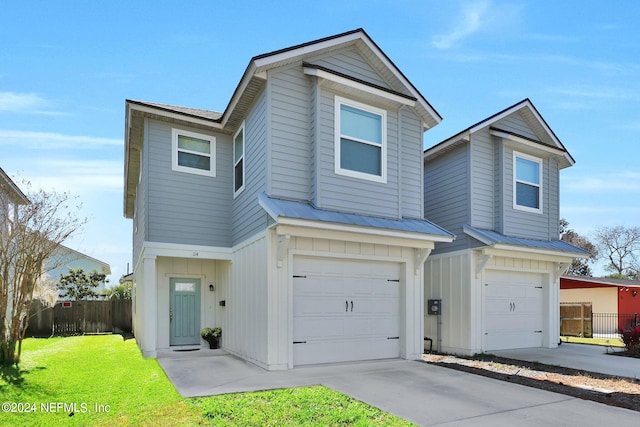 front facade featuring a garage and a front lawn