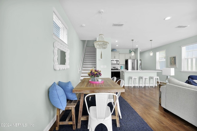 dining space with hardwood / wood-style floors