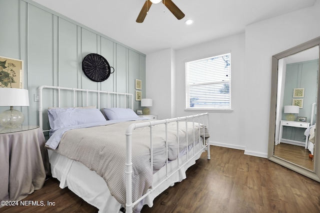 bedroom with ceiling fan and dark wood-type flooring