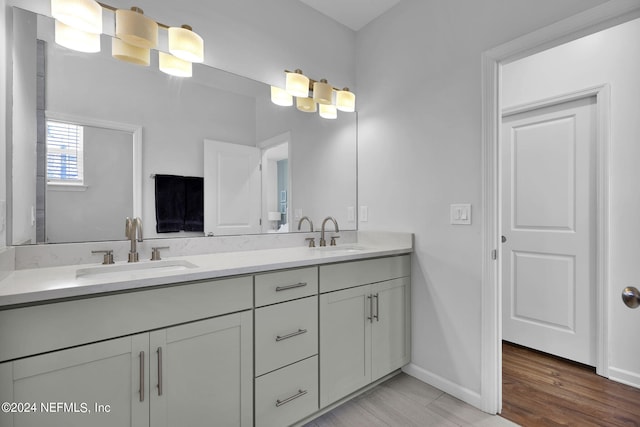 bathroom featuring hardwood / wood-style floors and vanity