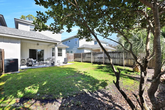 view of yard featuring ceiling fan, a patio area, and central air condition unit