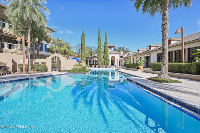 community pool with a residential view