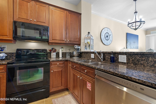 kitchen featuring dark stone counters, brown cabinets, crown molding, black appliances, and a sink