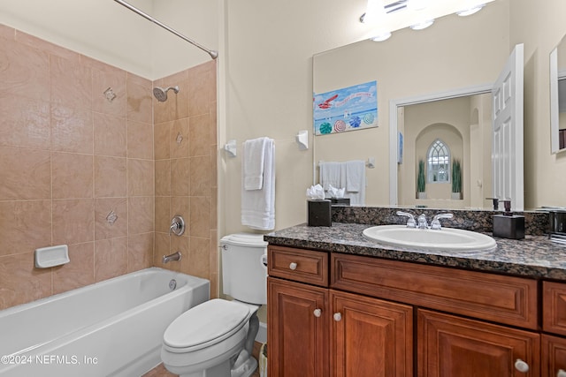 full bathroom featuring toilet,  shower combination, and vanity