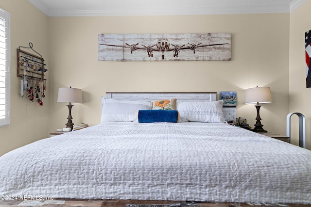 bedroom with crown molding