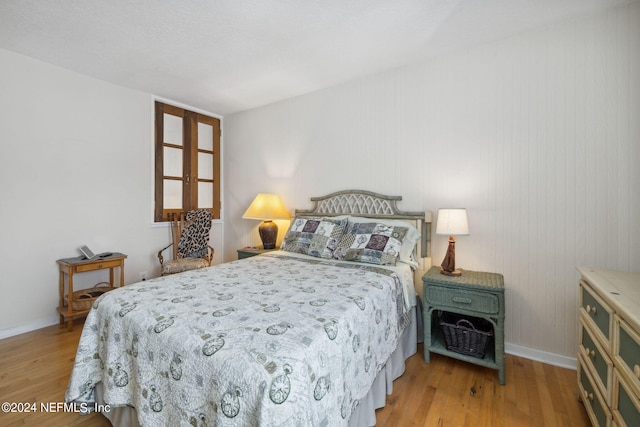 bedroom with light wood-type flooring