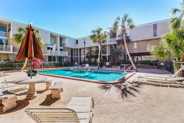 view of swimming pool with a patio area