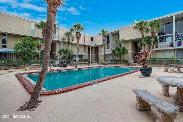 view of pool featuring a patio