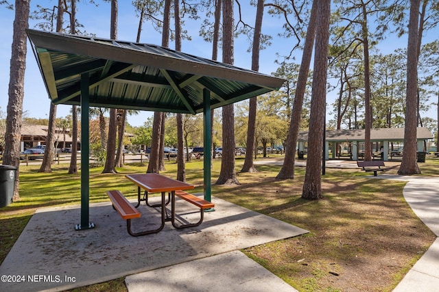 surrounding community with a lawn and a gazebo