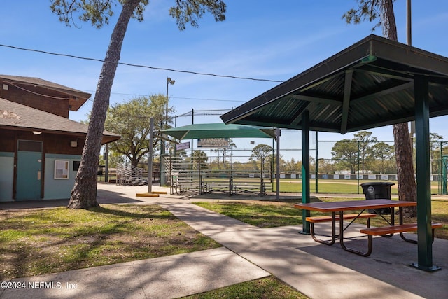 view of home's community with a lawn and a gazebo