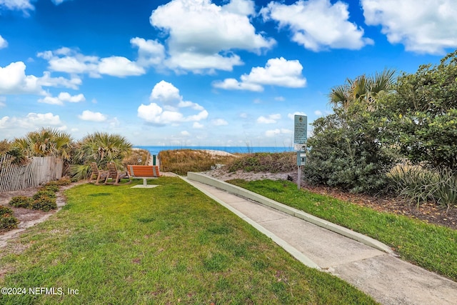 exterior space featuring a water view and a yard