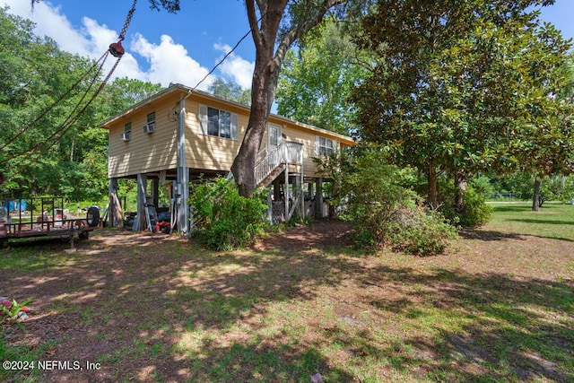 exterior space featuring driveway and stairs