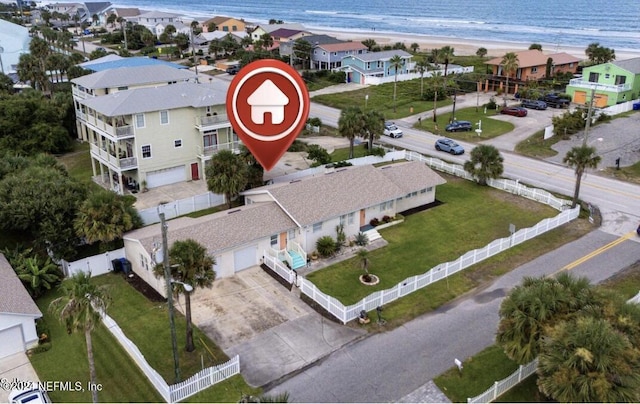 bird's eye view featuring a water view and a view of the beach