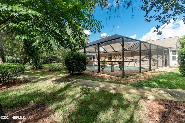 view of yard featuring a lanai