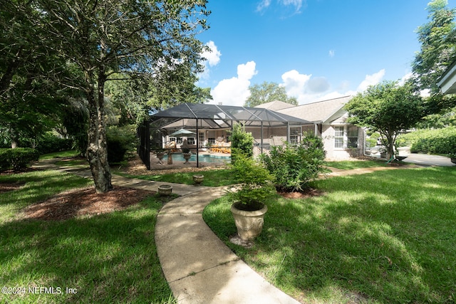 view of front of property with a front lawn and glass enclosure