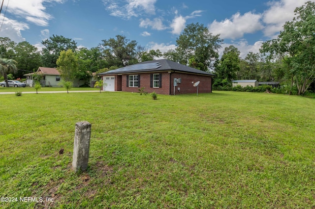 view of yard featuring a garage