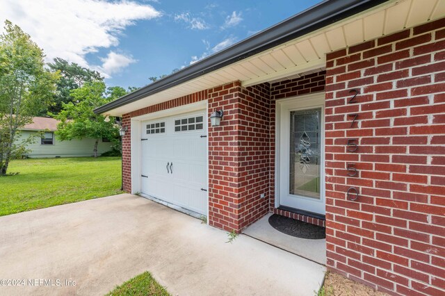 garage featuring a yard