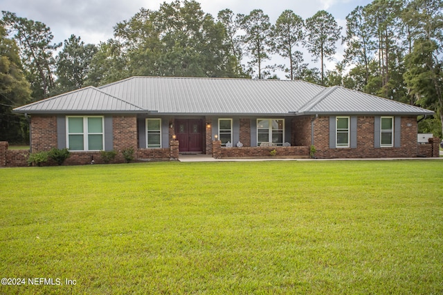 ranch-style house with a front lawn