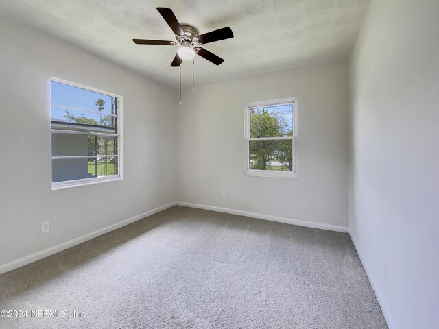 unfurnished room featuring carpet flooring and ceiling fan