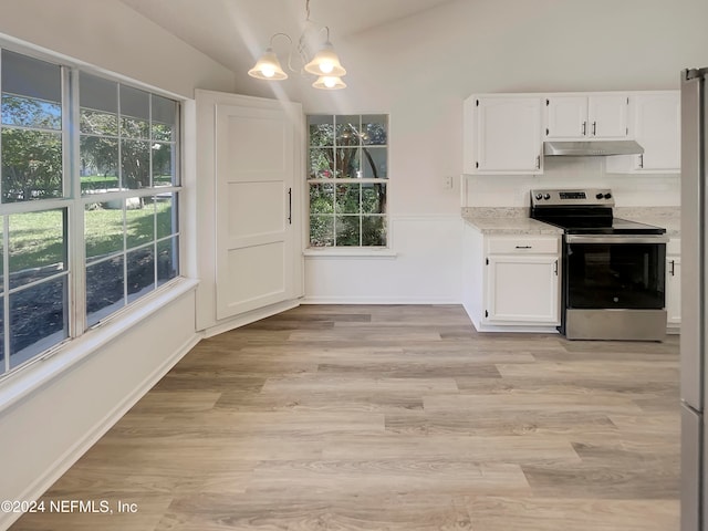 kitchen featuring light hardwood / wood-style flooring, lofted ceiling, a healthy amount of sunlight, and stainless steel electric range oven