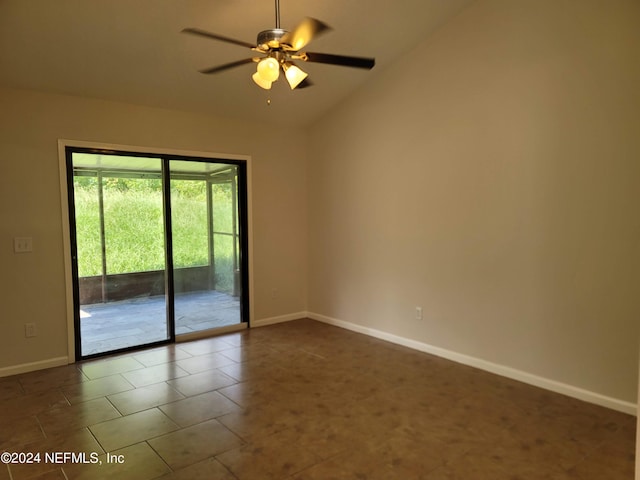 empty room with ceiling fan, tile patterned flooring, and vaulted ceiling