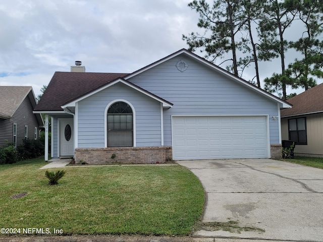 view of front facade featuring a garage and a front yard