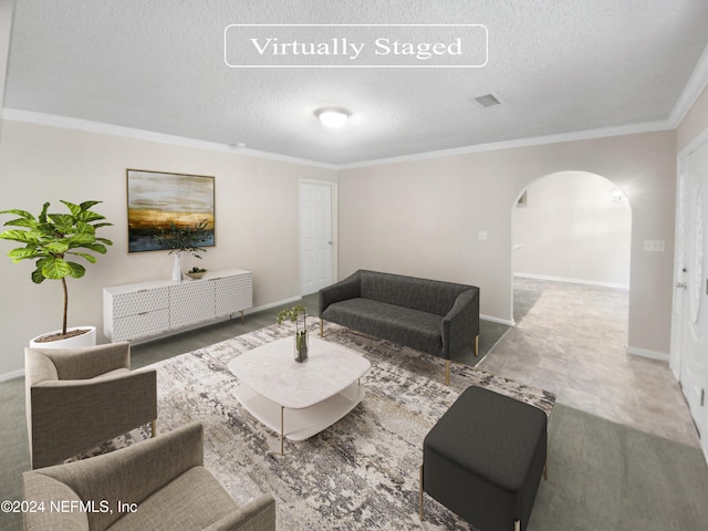 living room with arched walkways, ornamental molding, a textured ceiling, and baseboards