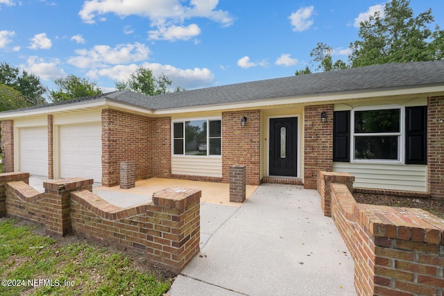 ranch-style home with a garage