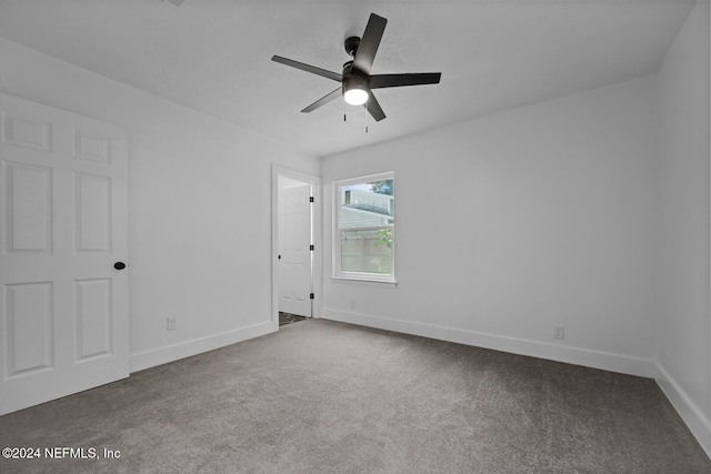 empty room with carpet and ceiling fan