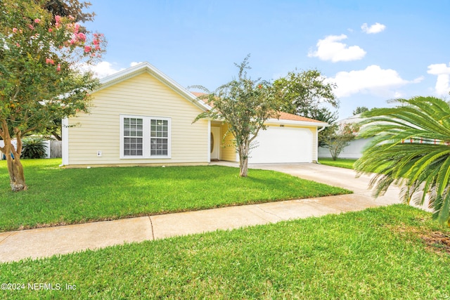 view of front facade featuring a garage and a front lawn