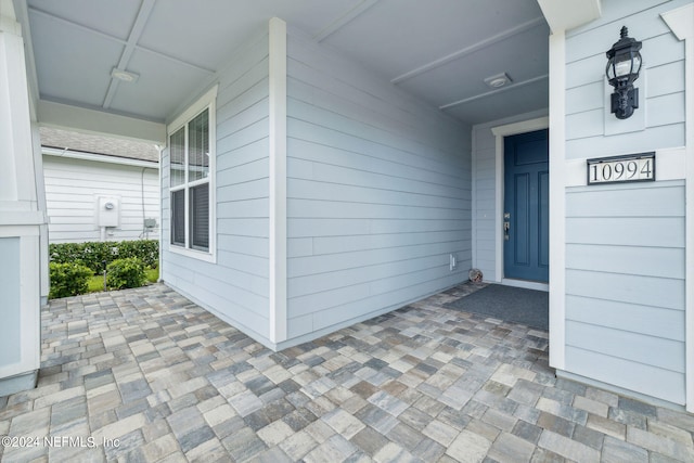 entrance to property with covered porch