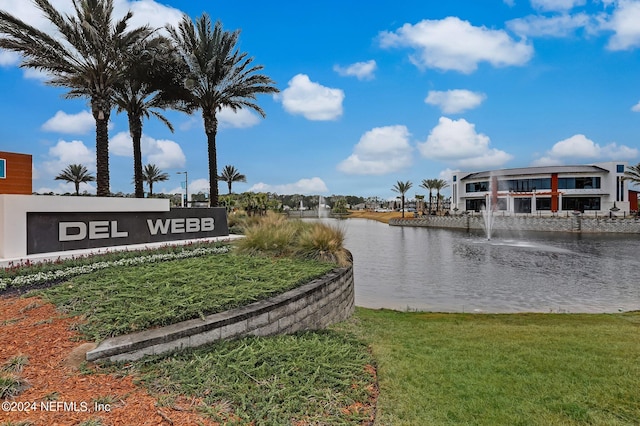 exterior space featuring a water view and a lawn