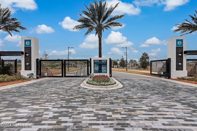 view of gate with fence