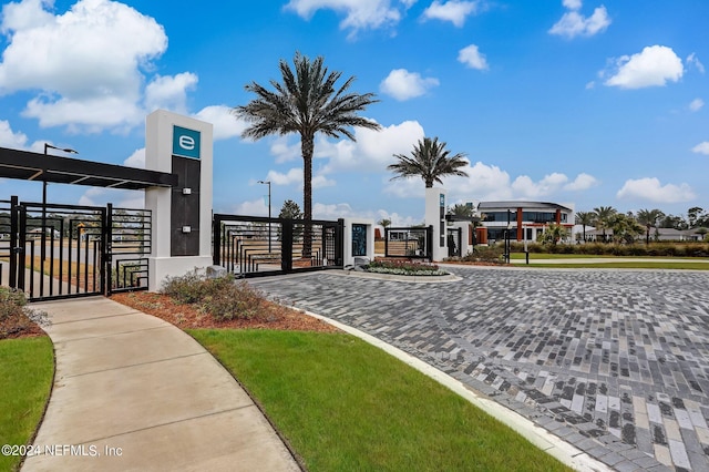 surrounding community featuring a gate and fence