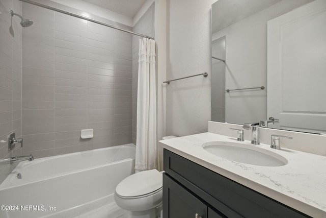 bathroom with toilet, shower / bath combination with curtain, and vanity