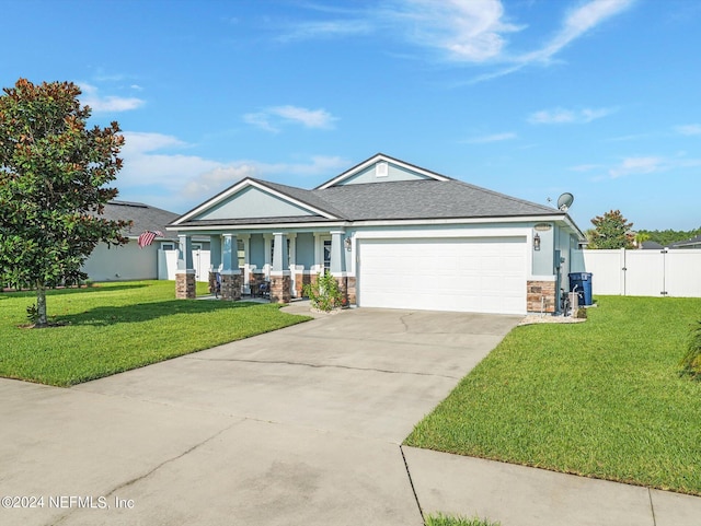 view of front of property with a front yard and a garage