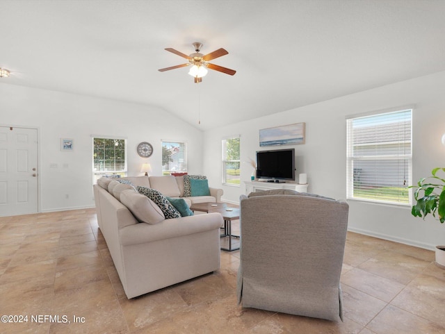 tiled living room featuring ceiling fan and lofted ceiling