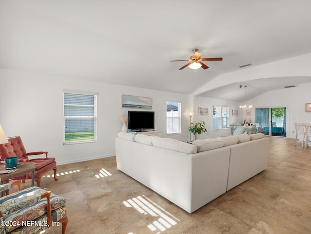 living room featuring lofted ceiling, a healthy amount of sunlight, and light tile patterned floors