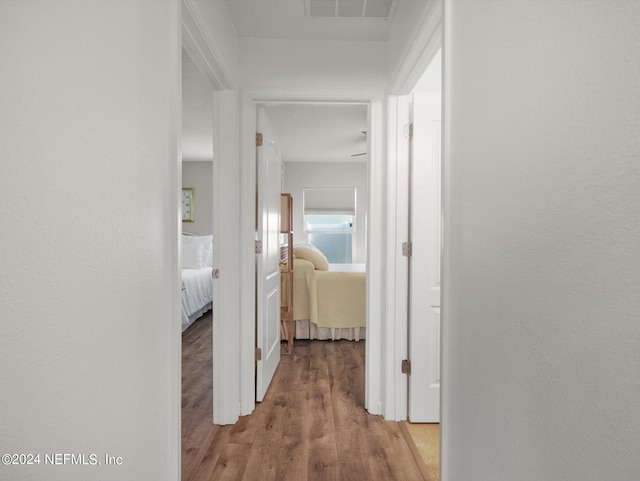 corridor featuring hardwood / wood-style flooring