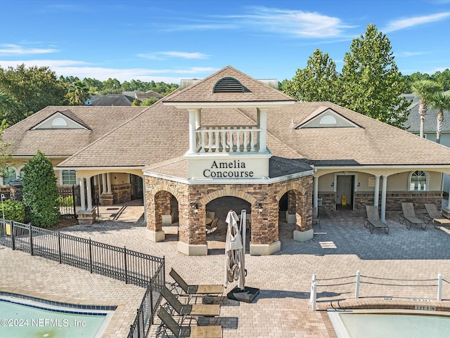 exterior space featuring a patio and a fenced in pool