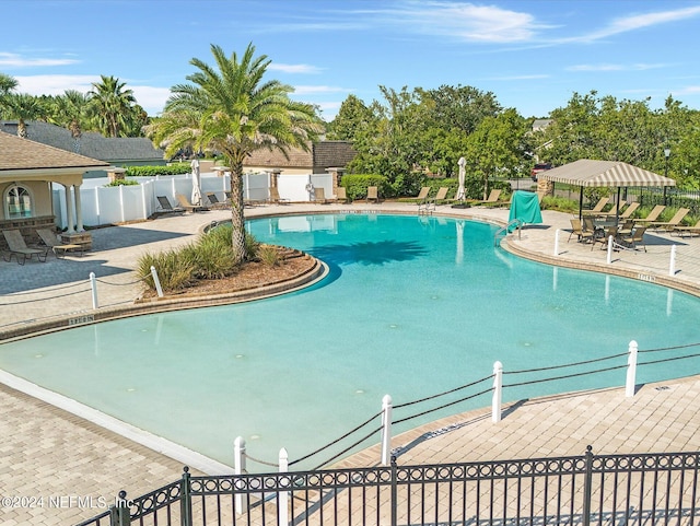 view of swimming pool with a patio area