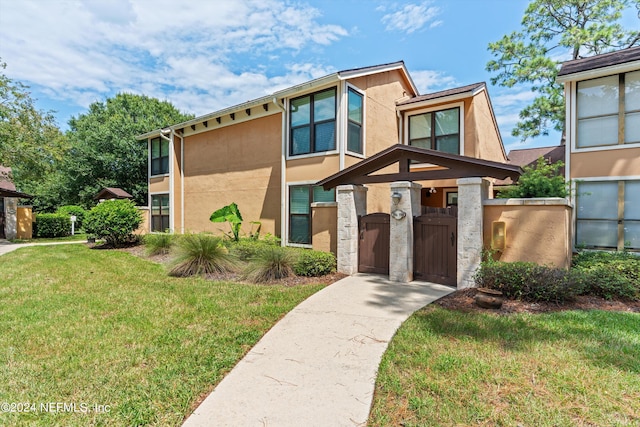 view of front of home with a front yard