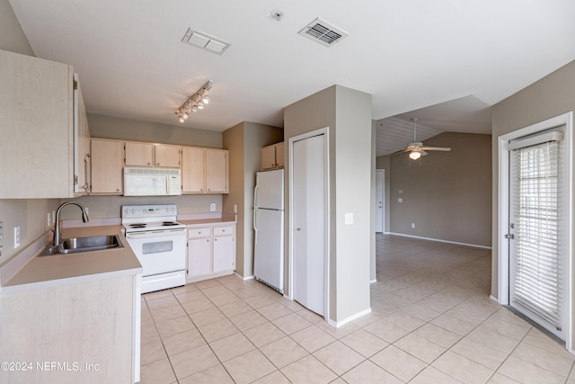 kitchen with light brown cabinets, white appliances, a sink, visible vents, and light countertops