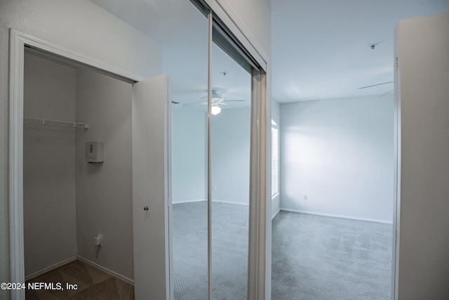 bathroom featuring a ceiling fan and baseboards