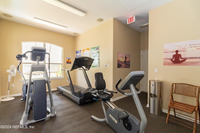 exercise room with baseboards