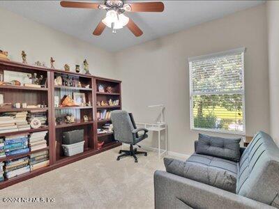 office with ceiling fan and carpet floors