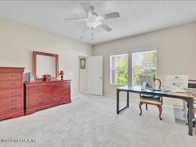 office area featuring ceiling fan and light carpet