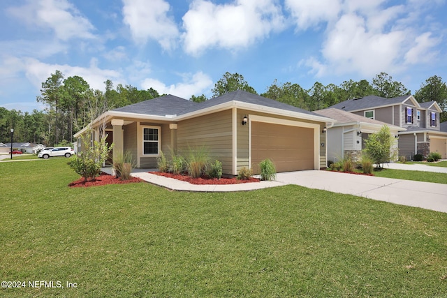 view of front of property with a garage and a front yard