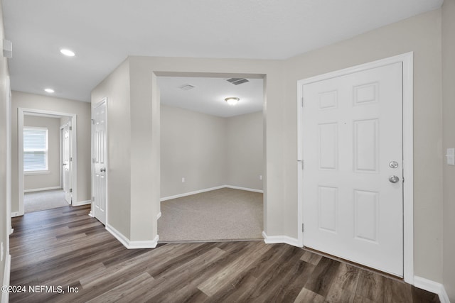 foyer entrance with dark wood-type flooring