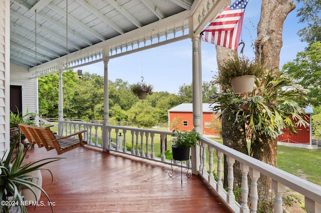 wooden terrace featuring covered porch